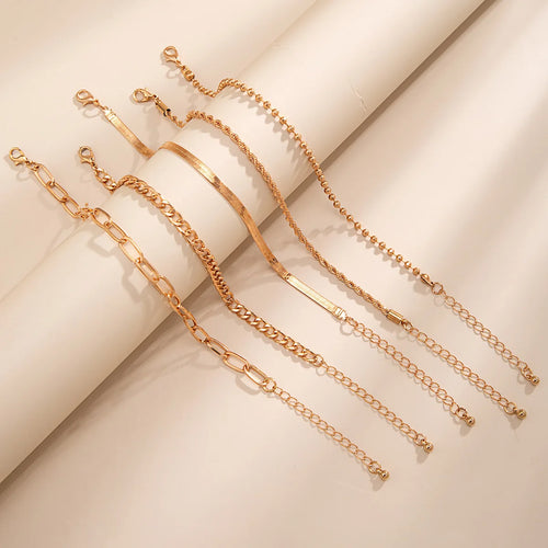 Set van 5 enkelbandjes goudkleurig